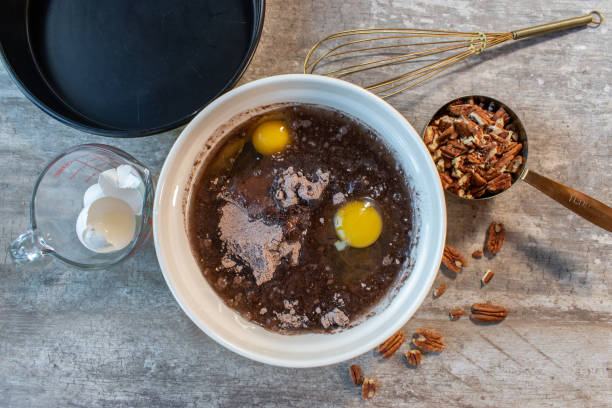 istock Mixing ingredients for chocolate brownies 1287114252
