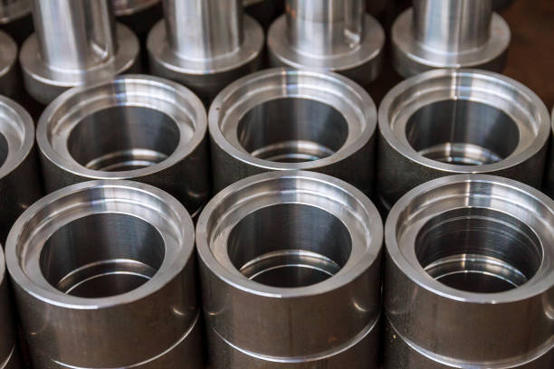 istock Metal cylindrical parts after processing on a modern CNC milling cutter. 1287116692