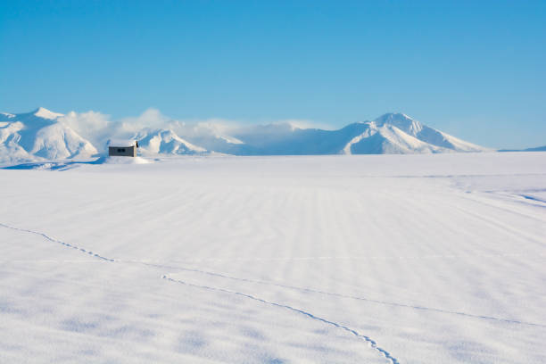 istock Snowfields and snowy mountains with a blue sky 1287119159