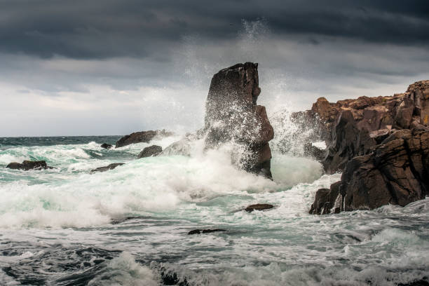 istock Powerful waves crashes in rocky coastline 1287120901
