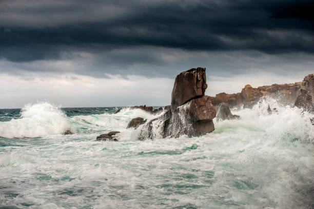 istock Powerful waves crashes in rocky coastline 1287120910