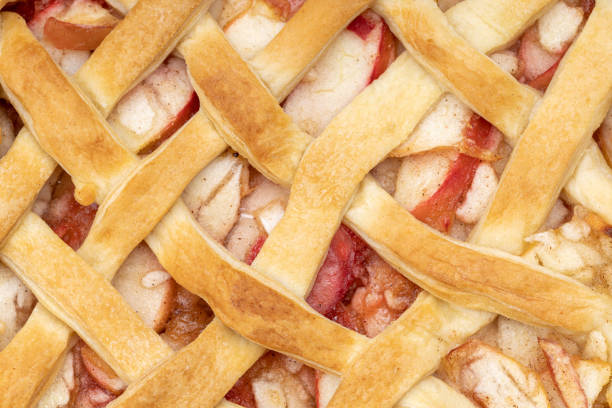 close up latticed american apple pie above view. background backdrop. studio shot. fresh traditional fruit pie.