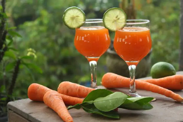 Fresh carrot juice with lime. Bright mood