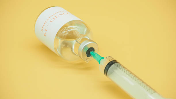 istock Medicine bottles and syringes 1287130850