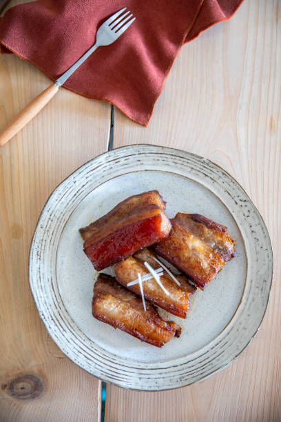 Some roasted pork belly on a plate.