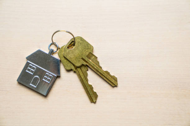 istock House keys and keychain on wooden background 1287131805
