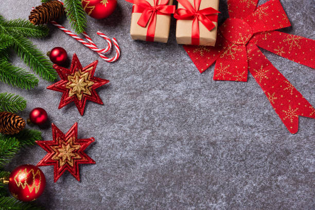 istock fir tree branches with Xmas ornament baubles 1287135069