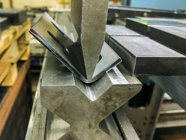 istock Bending sheet metal with a hydraulic bending machine 1287151876