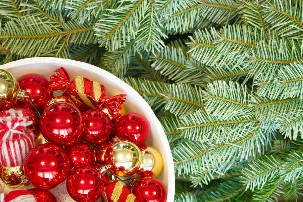 istock Christmas tree branches and Christmas decorations. Red balls and christmas tree branch 1287152894