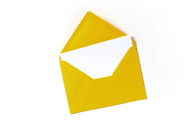 istock A greeting card in a yellow envelope mockup, overhead shot on a white background 1287157441