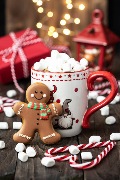 istock Christmas mugs  with hot chocolate and gingerbread cookies 1287160159