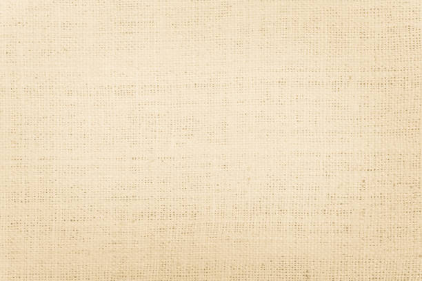 istock Brown Hemp rope texture background. Sackcloth or blanket wale linen wallpaper. Rustic sack canvas fabric texture in natural. Haircloth vintage linen burlap weaving, Old beige carpet background. 1287161186