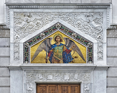 Trieste, Italy - October 27 2020: Detail of the front facade of the Serbian Orthodox church in Trieste, Italy with a mosaic of St. Michael.