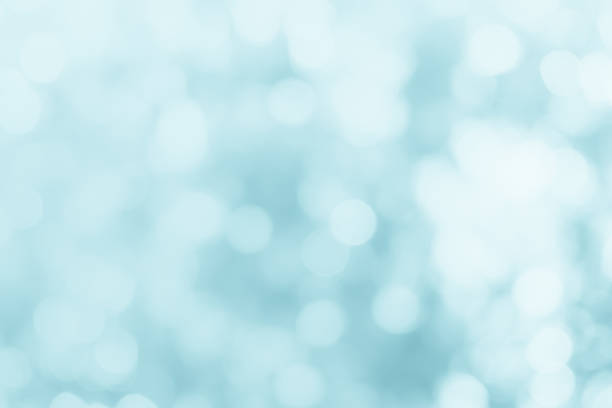 istock Natural spring blurred blue sea background. Create light soft blurred colors bright sunshine. Blue bokeh abstract glitter light background. Focus texture from nature fresh shiny growth seas the day. 1287162544