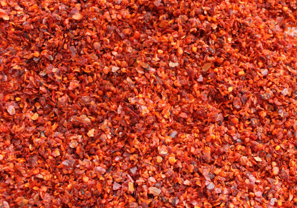 istock Red pepper spice background, dry and ground pepper 1287163535