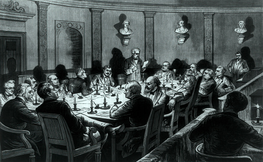 Vintage image shows the Electoral Commission meeting in the courtroom of the Supreme Court, Washington, D.C. in 1877. The commission was created by Congress to resolve the disputed presidential election of 1876 between Republican Rutherford B. Hayes and Democrat Samuel J. Tilden. The dispute was settled with the Compromise of 1877, which ensured the Republican Party candidate, Rutherford Hayes, would become the next president and the Democrats would regain political power in the southern state governments.