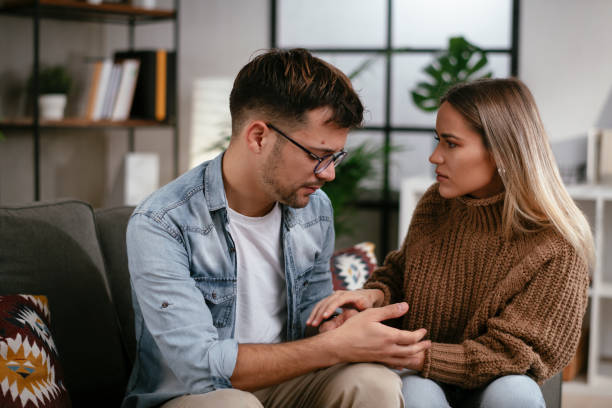 istock Girlfriend comforting her sad boyfriend. 1287167237