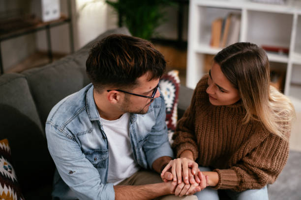 istock Girlfriend comforting her sad boyfriend. 1287168428