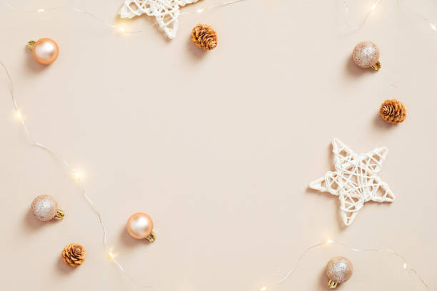 istock Modern Christmas flat lay composition. Elegant balls decorations, stars, cones on pastel beige background. Xmas greeting card mockup. Scandinavian, minimal style. 1287168514