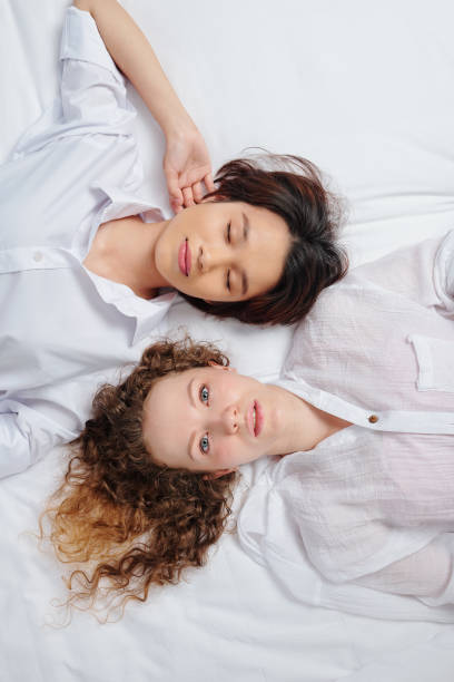 istock Beautiful girlfriends in bed 1287171498