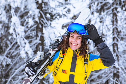 young gorgeous smiling woman with ski portrait winter vacation leisure activities