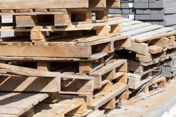 istock empty wooden pallets and new construction tiles 1287173706