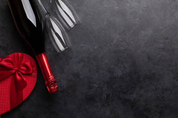 istock Valentines or Christmas card with champagne and gift 1287175667