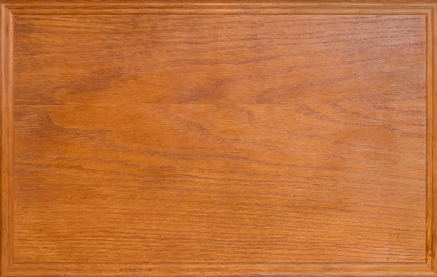 istock Varnished panel of natural oak wood, decorative frame around perimeter 1287176651