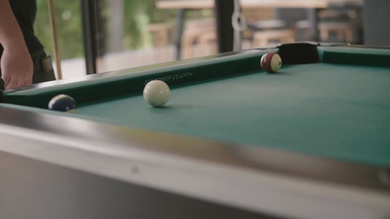 Man hits cue ball