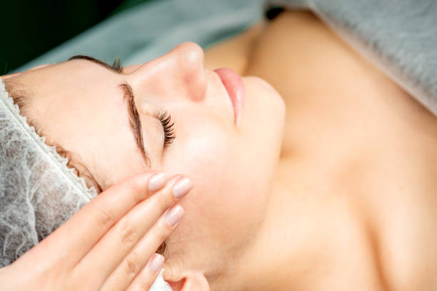 istock Young woman getting facial massage 1287179410
