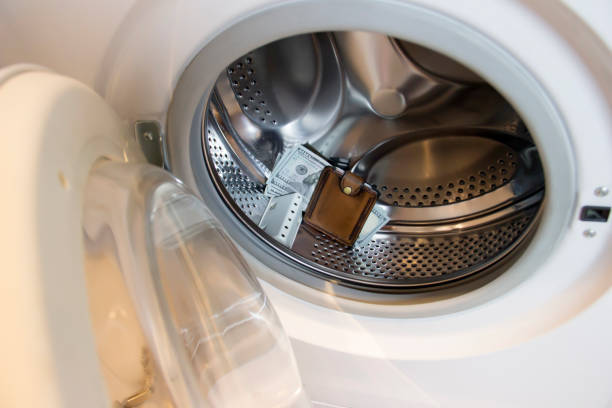 istock Washing machine washed money with a wallet. 1287179579