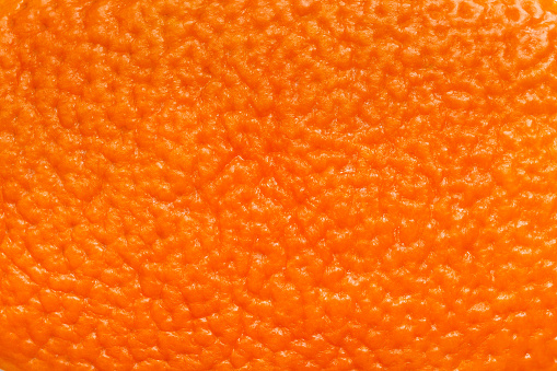Orange skin closeup. Orange skin texture. Natural background