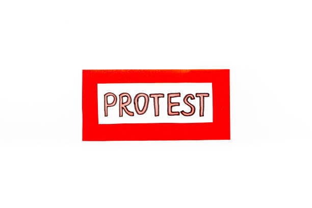 istock Protest sign concept. Word Protest on paper banner, top view 1287181524