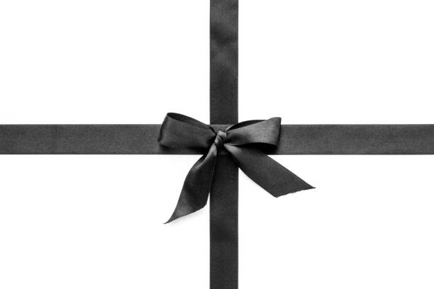 istock Black ribbon with bow isolated on white. Top view, copy space 1287181800
