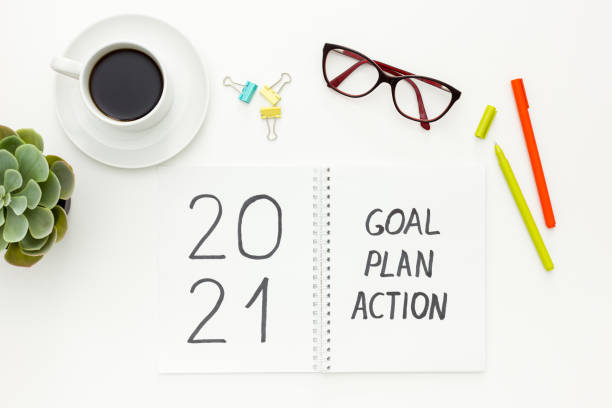 istock 2021 New Year goals and plan with Christmas decorations on white 1287182175
