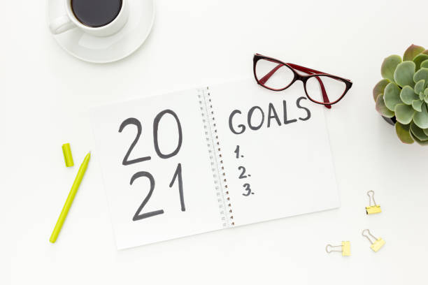 istock New year goals list. Christmas decorations and notebook 1287182272