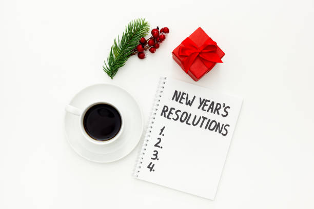 istock New Year's resolutions with Christmas decorations on white 1287182275