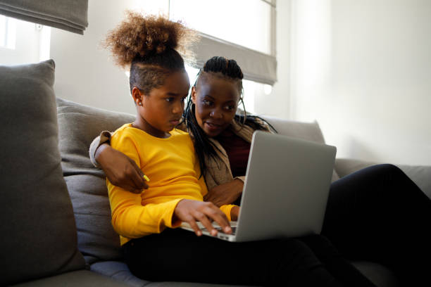 istock Mom and daughter using a laptop 1287183198
