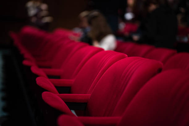 istock Empty red seats in a theatre 1287183516