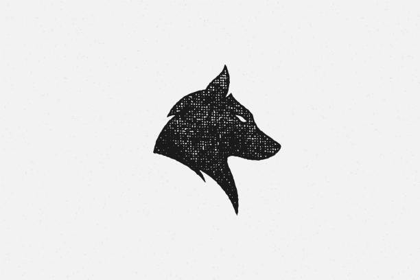 silhouette des kopfes wilden wolf als symbol wildlife handgezeichnetstempel effekt vektor-illustration - wolf stock-grafiken, -clipart, -cartoons und -symbole