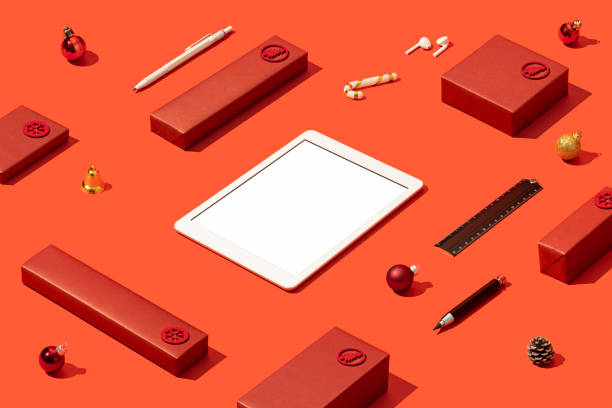 istock Digital tablet mockup, template on red background with red gift boxes 1287183922