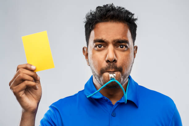 istock indian referee whistling and showing yellow card 1287185091