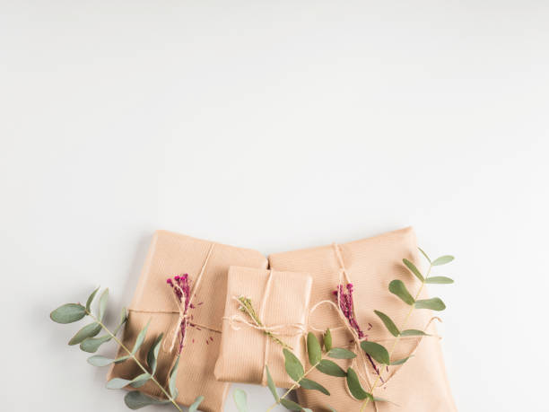 istock Gift boxes wrapped in craft paper with dried flowers 1287186298