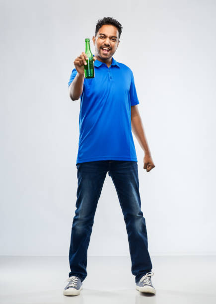istock male fan with beer bottle celebrating victory 1287187945