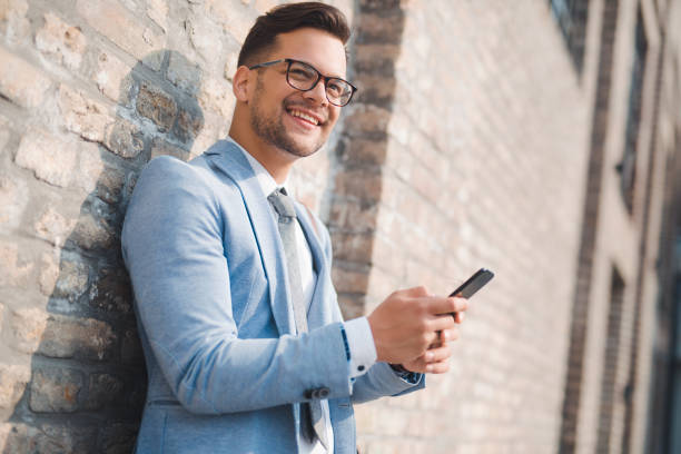 istock Successful  manager holding smartphone 1287188349