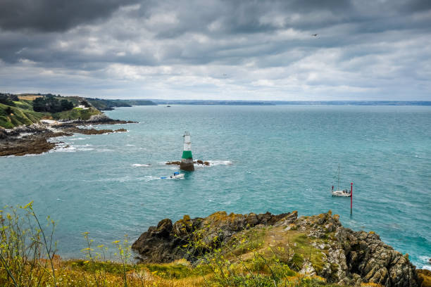 lighthouse and coast landscape in brittany, france - storm lighthouse cloudscape sea imagens e fotografias de stock