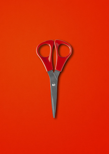 Pair of scissors mockup isolated on red background