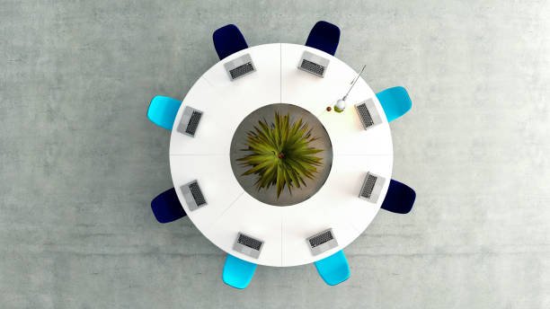 Modern meeting room top view with round white table or desk, light and dark blue chairs, concrete floor concept 3D rendering