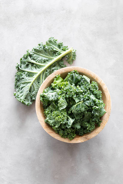 istock Fresh kale curly leaves, superfood 1287192772