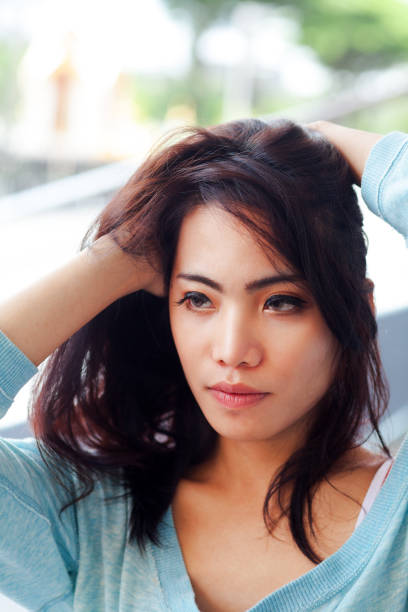 istock Filipina transgender moving hands through long hair 1287192921